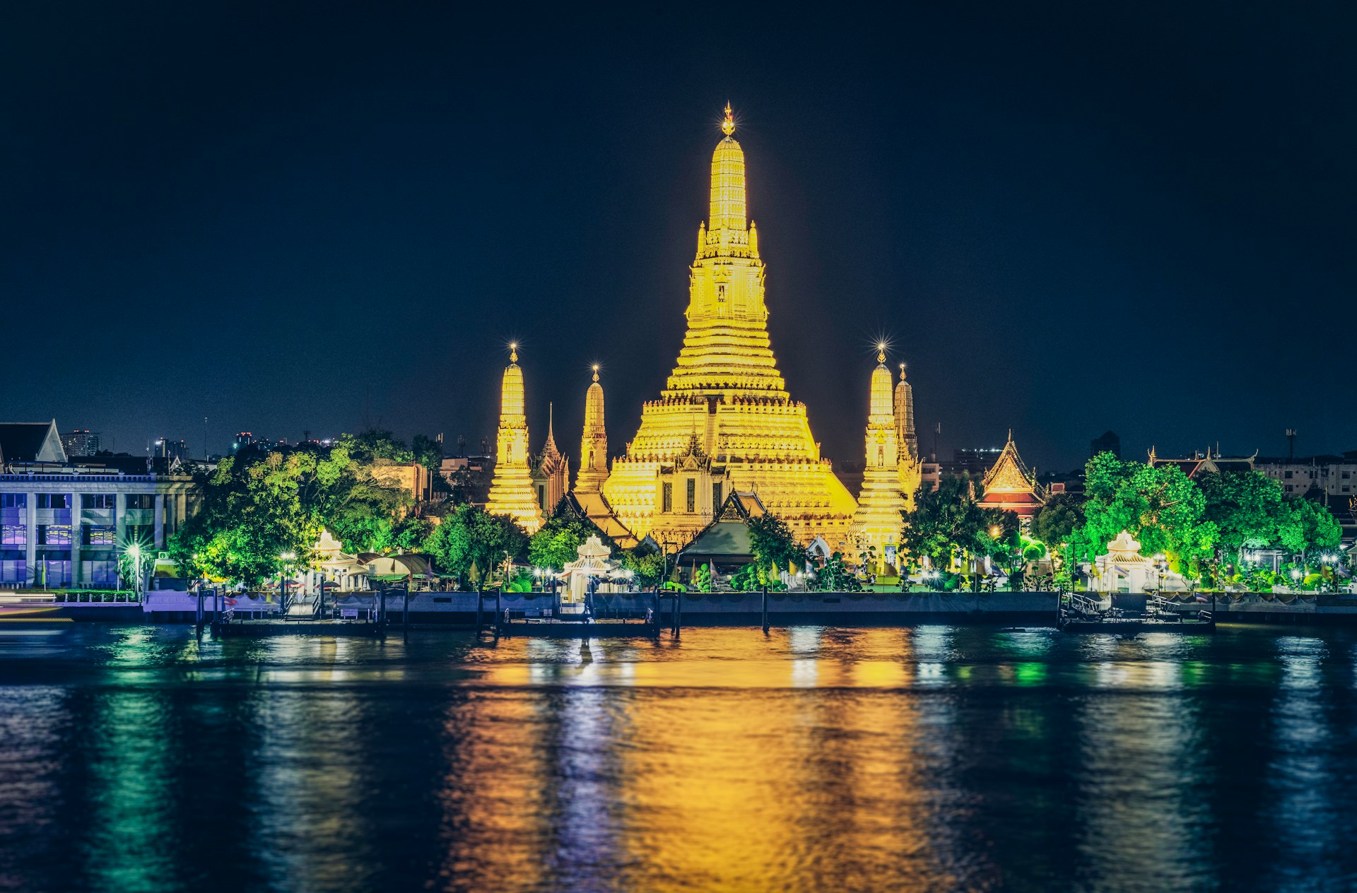 building near body of water at night